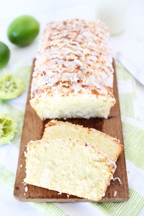 Coconut Lime Loaf Cake Recipe on twopeasandtheirpod.com This simple coconut lime loaf cake is drizzled with a sweet lime glaze and topped with toasted coconut! Coconut Lime Loaf Cake Recipe
