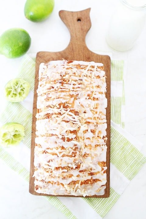 Coconut Lime Loaf Cake Recipe on twopeasandtheirpod.com This simple coconut lime loaf cake is drizzled with a sweet lime glaze and topped with toasted coconut! Everyone loves this dessert! Coconut Lime Loaf Cake Recipe