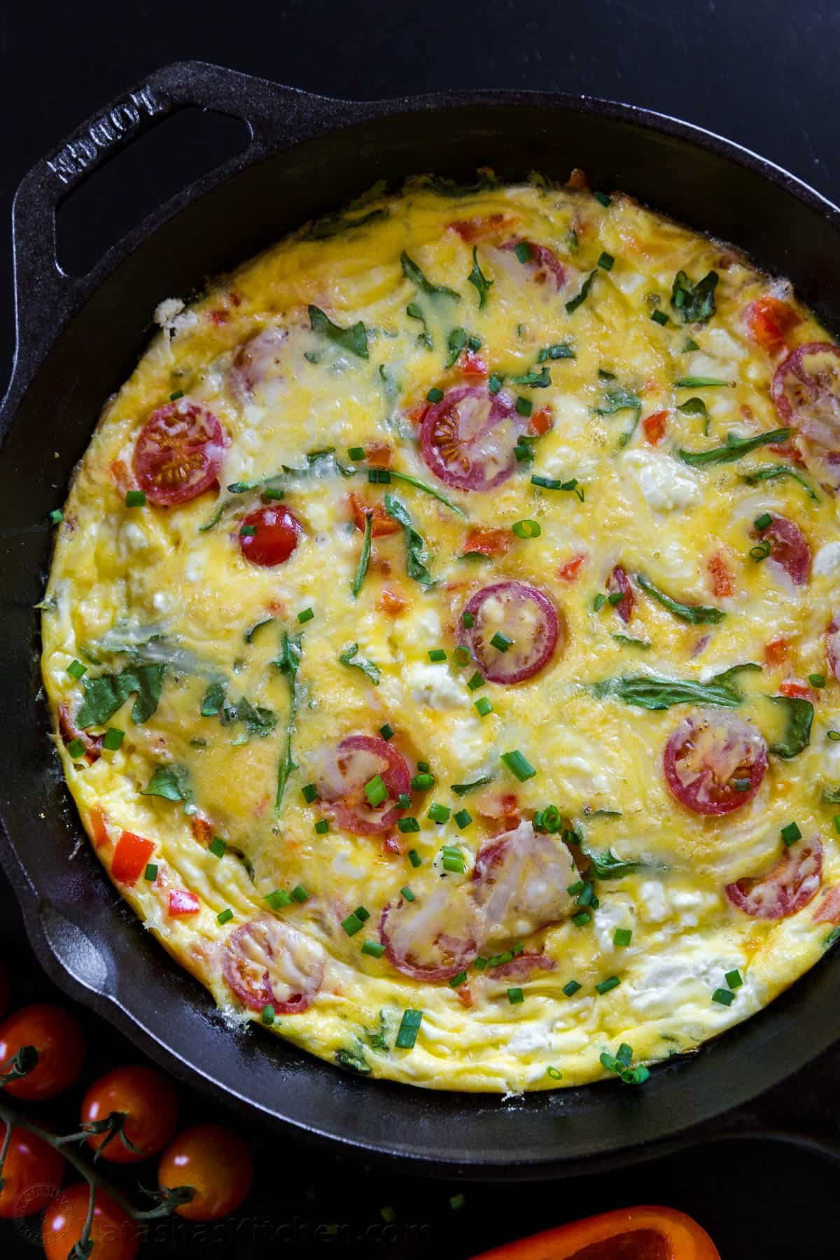 Frittatas are so easy with just a few ingredients. This one-pan breakfast Frittata Recipe is extremely versatile with endless variations. a pan with a perfectly baked frittata in it