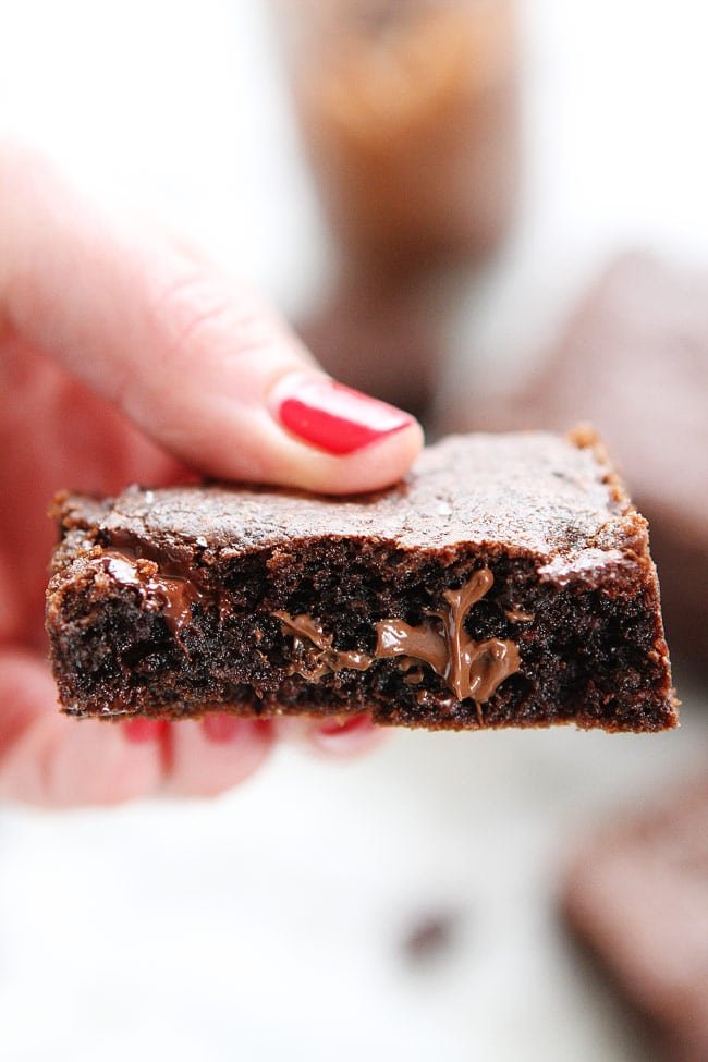 Chocolate Nutella Cookie Bars with Sea Salt Recipe on twopeasandtheirpod.com These rich and fudgy cookie bars are loaded with chocolate chunks, Nutella, and sprinkled with sea salt. Dessert perfection! Chocolate Nutella Cookie Bars with Sea Salt Recipe