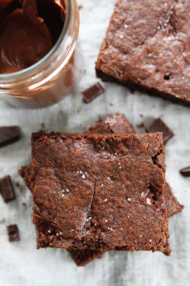 Chocolate Nutella Cookie Bars with Sea Salt Recipe on twopeasandtheirpod.com These rich and fudgy cookie bars are loaded with chocolate chunks, Nutella, and sprinkled with sea salt. They are amazing! Chocolate Nutella Cookie Bars with Sea Salt Recipe
