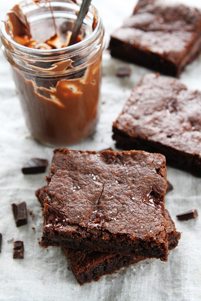 Chocolate Nutella Cookie Bars with Sea Salt Recipe on twopeasandtheirpod.com These rich and fudgy cookie bars are loaded with chocolate chunks, Nutella, and sprinkled with sea salt. I LOVE these cookie bars! Chocolate Nutella Cookie Bars with Sea Salt Recipe