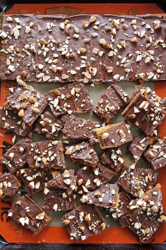 Easy Graham Cracker Toffee Recipe on twopeasandtheirpod.com You only need 5 ingredients to make this delicious toffee! It is a family favorite and make a great gift! Easy Graham Cracker Toffee Recipe