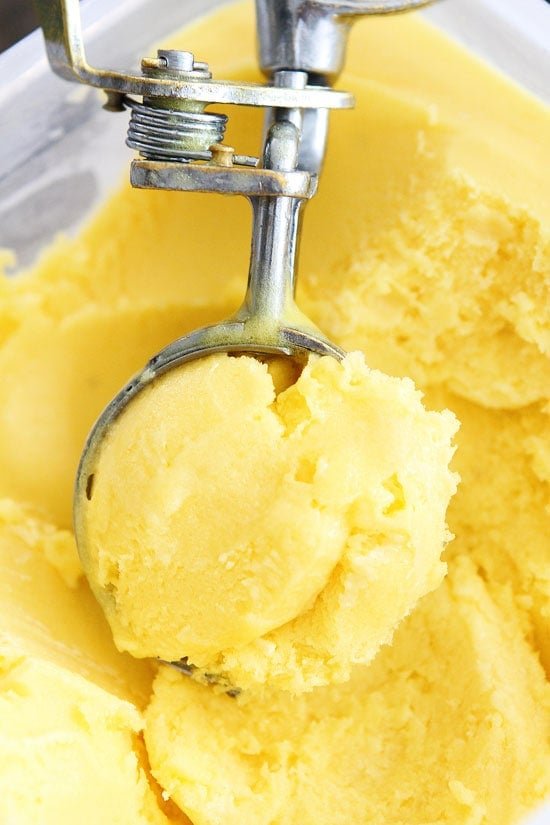 Pineapple Mango Sorbet Recipe on twopeasandtheirpod.com Cool down with a scoop of this sweet and refreshing sorbet! Pineapple Mango Sorbet Recipe