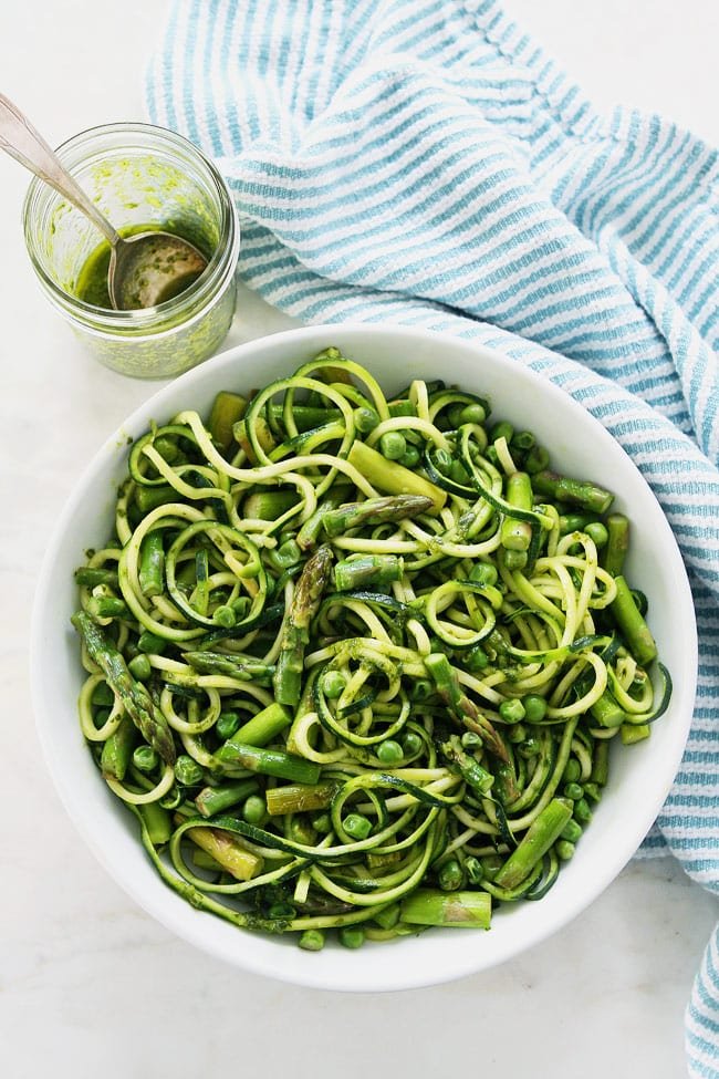 Zucchini Noodles with Asparagus, Peas, and Basil Vinaigrette Recipe on twopeasandtheirpod.com This gluten-free and vegan zucchini noodle dish is perfect for spring. It is light, refreshing, and super simple to make. Zucchini Noodles with Asparagus, Peas, and Basil Vinaigrette Recipe