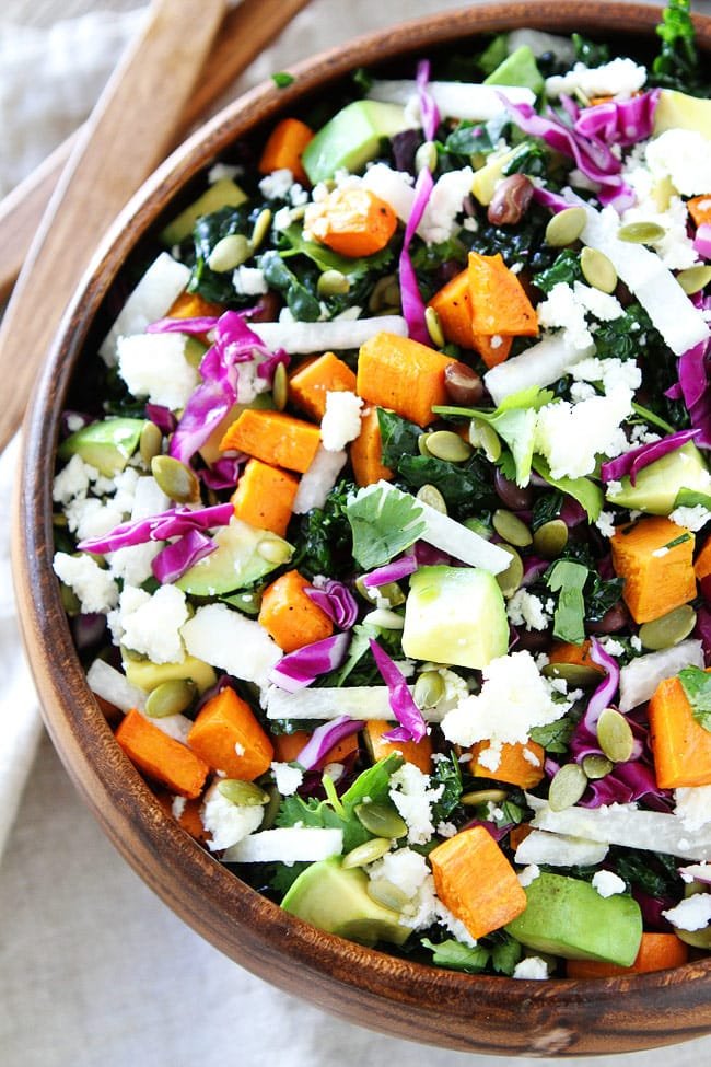Sweet Potato and Black Bean Kale Salad Recipe on twopeasandtheirpod.com This beautiful and healthy kale salad is great as a side dish or main dish! It is the perfect fall salad! Sweet Potato and Black Bean Kale Salad Recipe