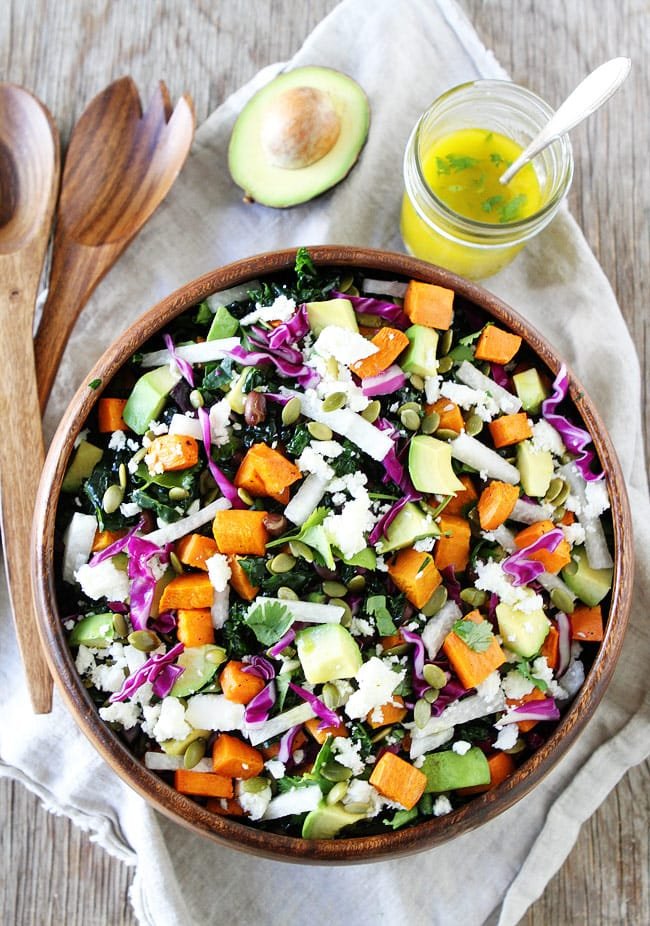 Sweet Potato and Black Bean Kale Salad Recipe on twopeasandtheirpod.com This beautiful and colorful kale salad is great as a side dish or main dish! Sweet Potato and Black Bean Kale Salad Recipe