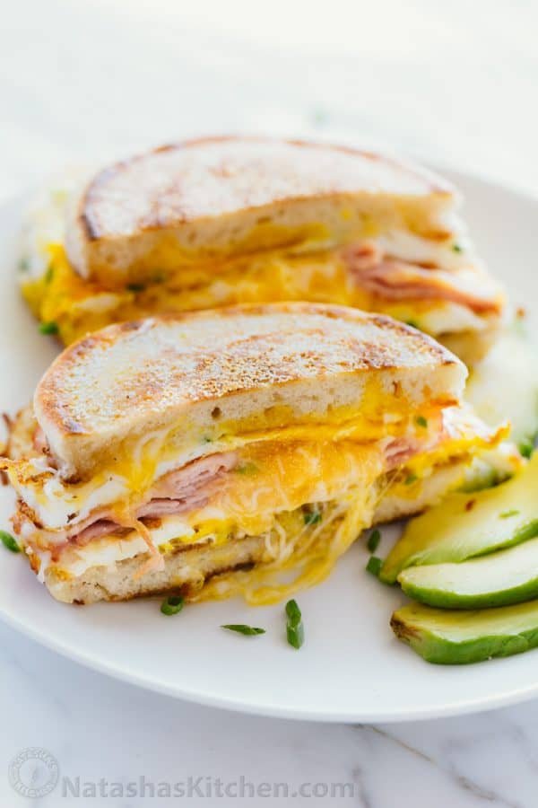 This breakfast sandwich is cheesy, juicy, easy and so delicious! All you need is 5 minutes and 5 ingredients. A one-pan breakfast sandwich recipe with video | natashaskitchen.com