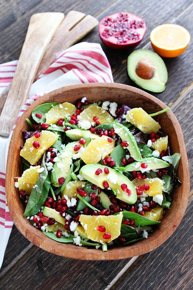 Pomegranate, Orange, and Avocado Salad Recipe on twopeasandtheirpod.com This easy and healthy salad is gorgeous! It goes great with any meal too! Make it today! Pomegranate, Orange, and Avocado Salad Recipe