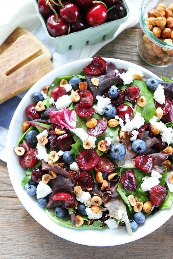 Balsamic Grilled Cherry, Blueberry, Goat Cheese, and Candied Hazelnut Salad Recipe on twopeasandtheirpod.com Make this salad for the 4th of July! Balsamic Grilled Cherry, Blueberry, Goat Cheese, and Candied Hazelnut Salad Recipe
