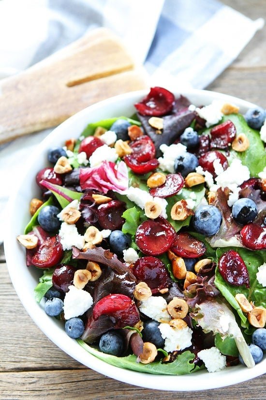 Balsamic Grilled Cherry, Blueberry, Goat Cheese, and Candied Hazelnut Salad Recipe on twopeasandtheirpod.com This is the BEST salad for summertime! Balsamic Grilled Cherry, Blueberry, Goat Cheese, and Candied Hazelnut Salad Recipe