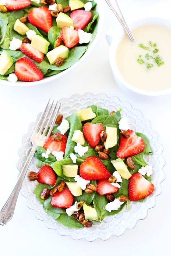 Strawberry Spinach Salad with Avocado, Goat Cheese, and Candied Pistachios Recipe on twopeasandtheirpod.com My favorite spring salad! It is great for lunch or dinner! Strawberry Spinach Salad with Avocado, Goat Cheese, and Candied Pistachios Recipe