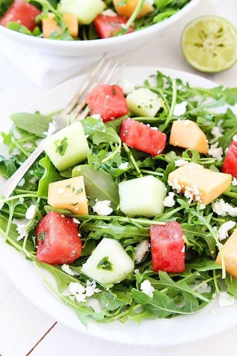 Melon Arugula Salad with Honey Lime Dressing Melon Arugula Salad with Honey Lime Dressing Recipe on twopeasandtheirpod.com #salad #recipe #glutenfree