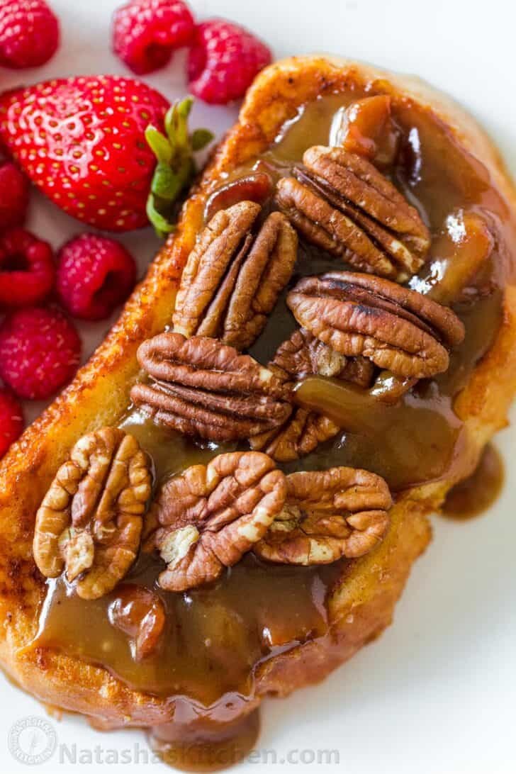 French toast sauteed and assembled on a plate served with berries