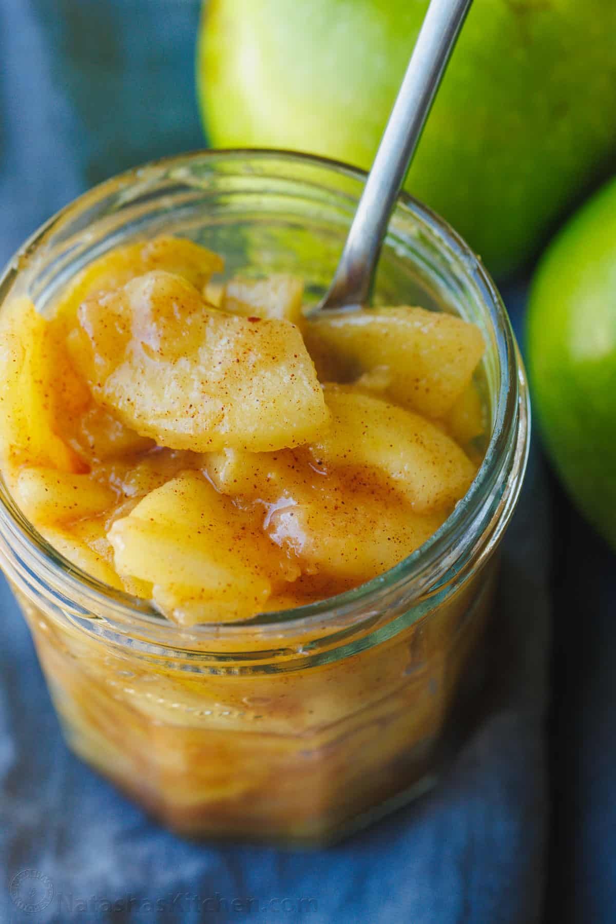 Easy sauteed cinnamon apples taste just like the filling in a cozy apple pie. Quick to make and perfect as a topping for breakfast or dessert. cinnamon apples stored in a mason jar