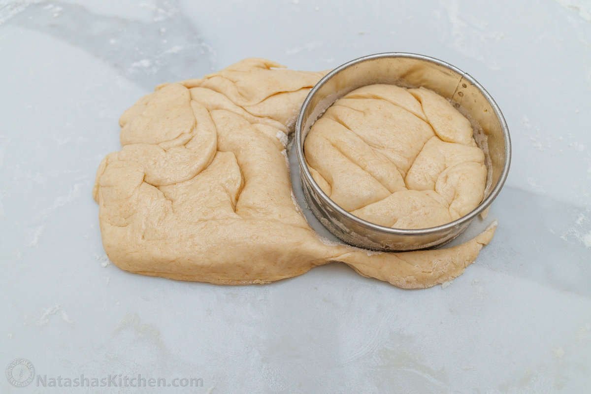 biscuit cutter to shape breakfast bread dough into a circle