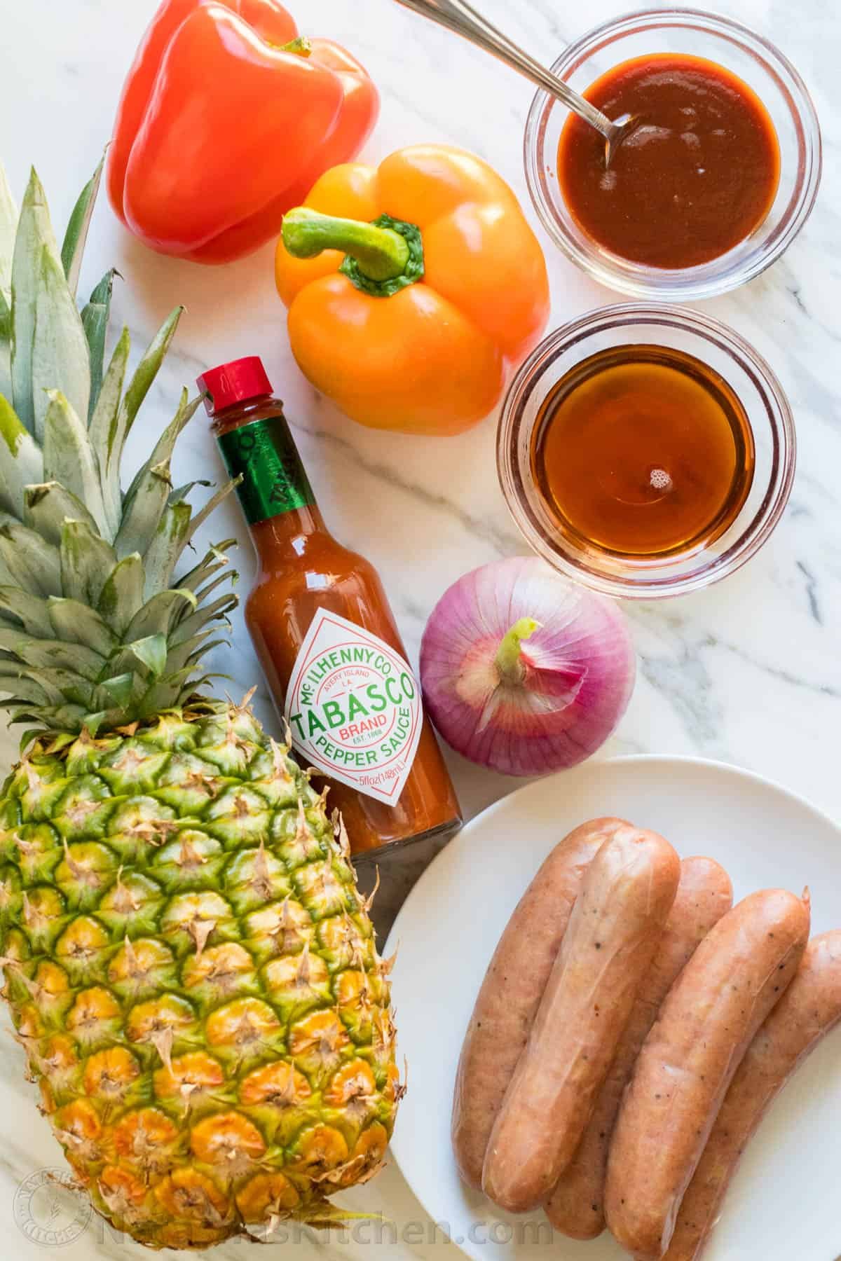 Grilled pineapple sausage Kabobs are sweet, spicy, smoky, and tasty! You'll love the easy glaze on these pineapple sausage kabobs. Grilled pineapple sausage skewers that are sweet, spicy, smoky and so flavorful! You won’t believe the easy glaze. Easy, excellent brunch skewers recipe. | natashaskitchen.com