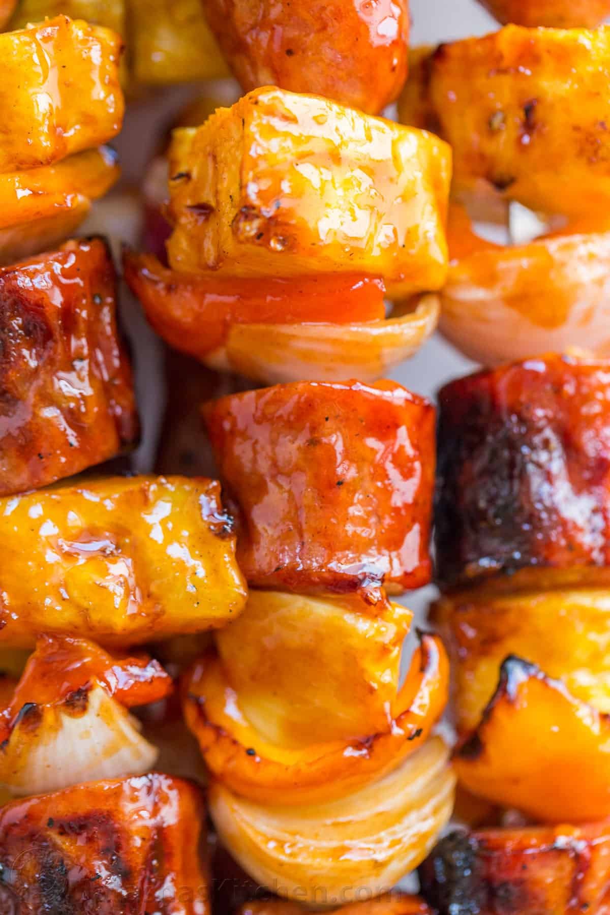 Grilled pineapple sausage Kabobs are sweet, spicy, smoky, and tasty! You'll love the easy glaze on these pineapple sausage kabobs. Grilled pineapple sausage skewers that are sweet, spicy, smoky and so flavorful! You won’t believe the easy glaze. Easy, excellent brunch skewers recipe. | natashaskitchen.com