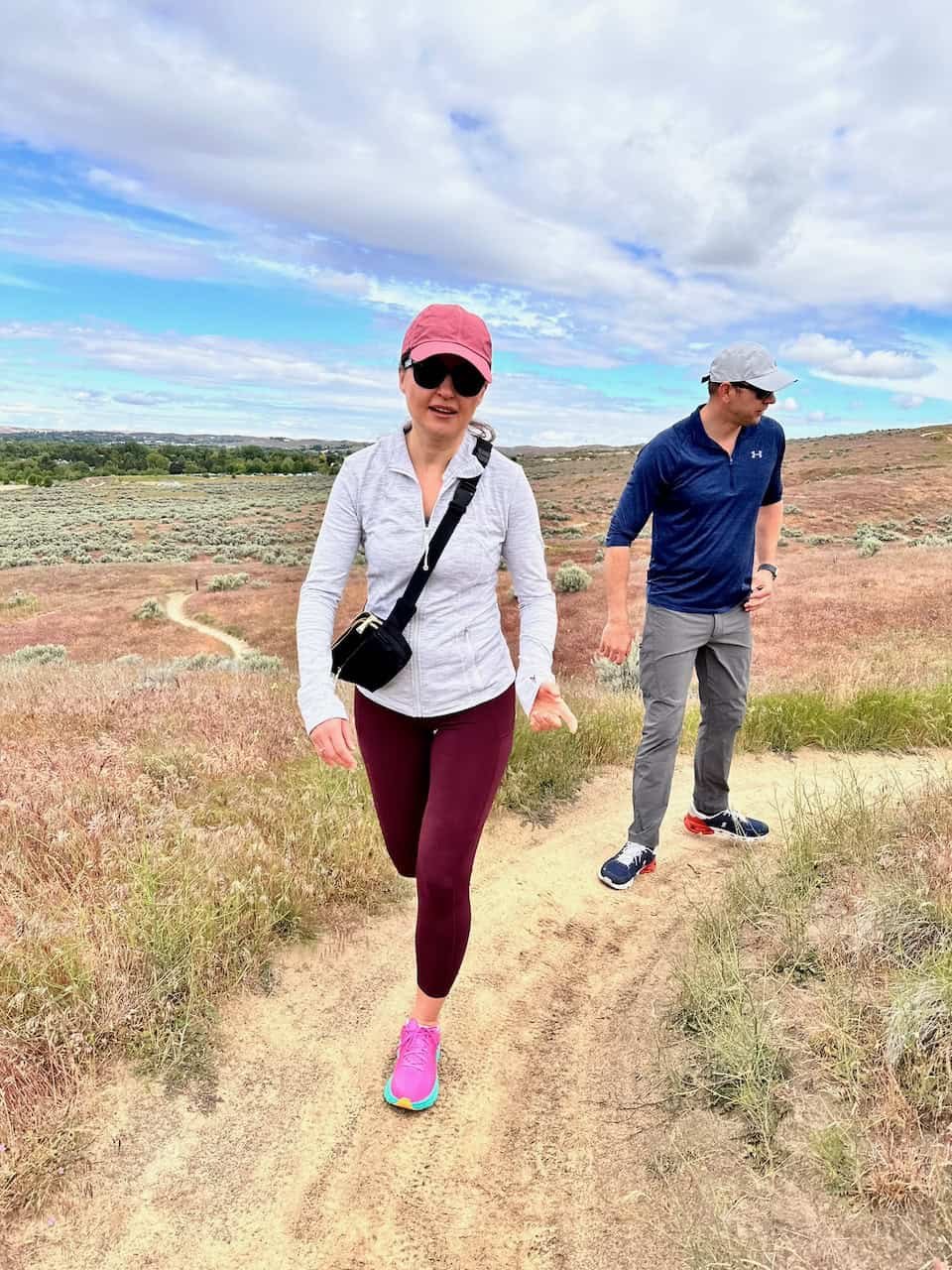 Natasha and Vadim enjoying a hike together on a sunny day