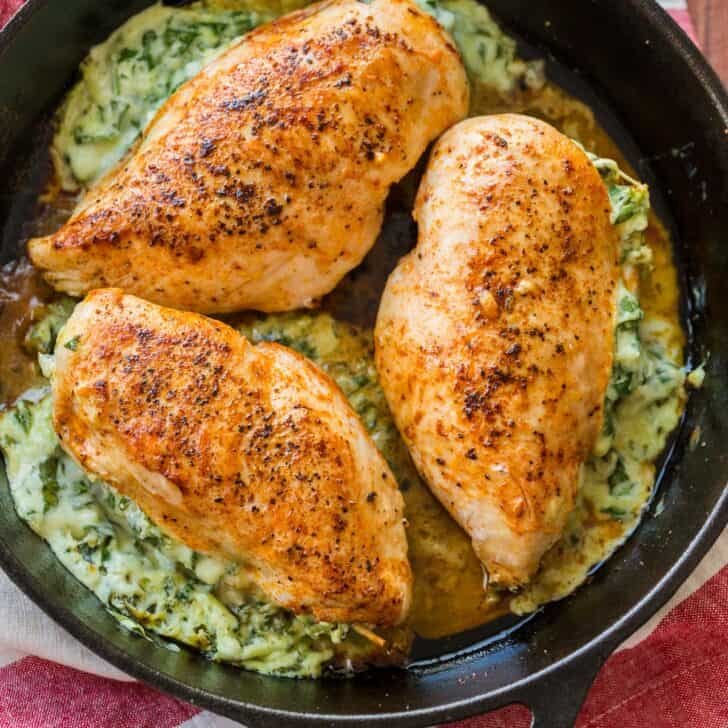 Spinach stuffed chicken breast in skillet