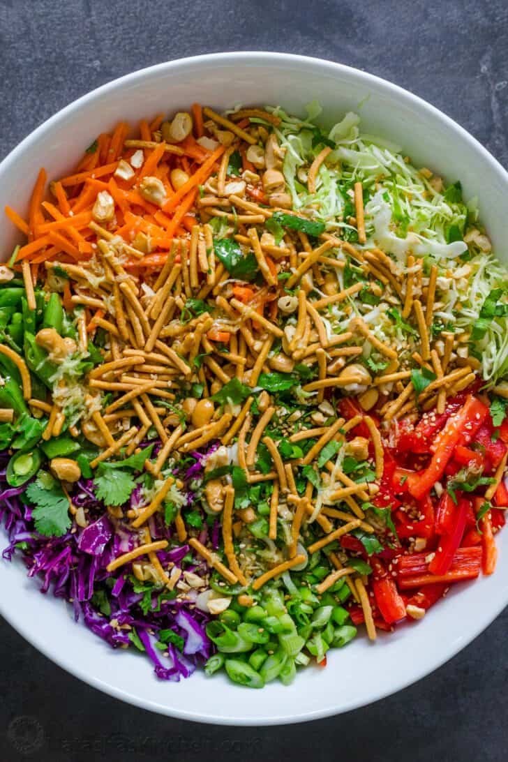 Asian Salad Ingredients layered in a salad bowl. 