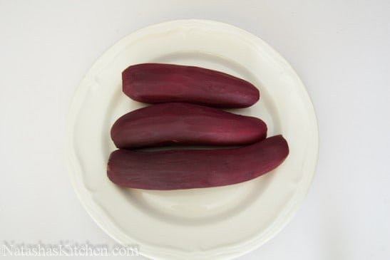 3 cooked and peeled beets on a plate 