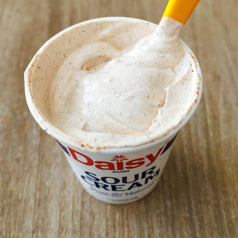Add homemade taco seasoning to sour cream for 7-Layer Dip