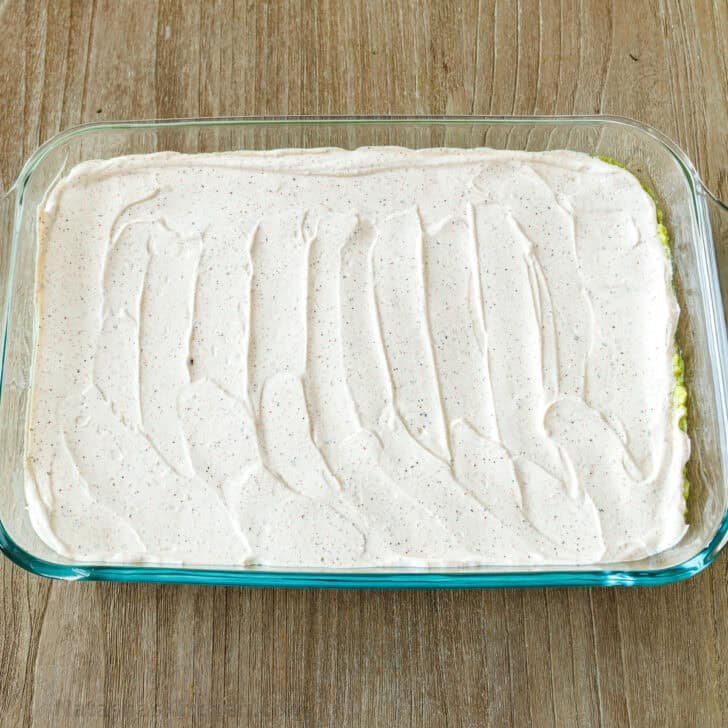 Sour cream seasoned with Taco Seasoning, layered for 7-Layer Dip