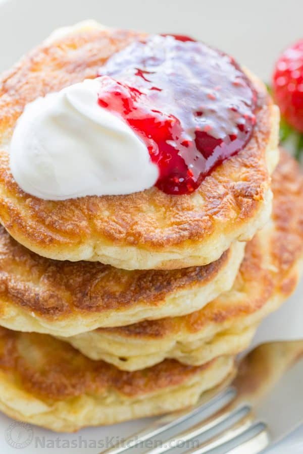 Apple and cheese pancakes are so light and fluffy. Serve these Ukrainian cheese pancakes with jam and sour cream for an unforgettable breakfast!