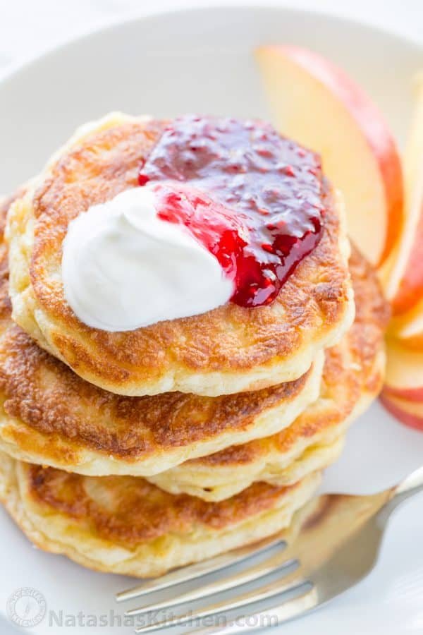 Apple and cheese pancakes are so light and fluffy. Serve these Ukrainian cheese pancakes with jam and sour cream for an unforgettable breakfast!