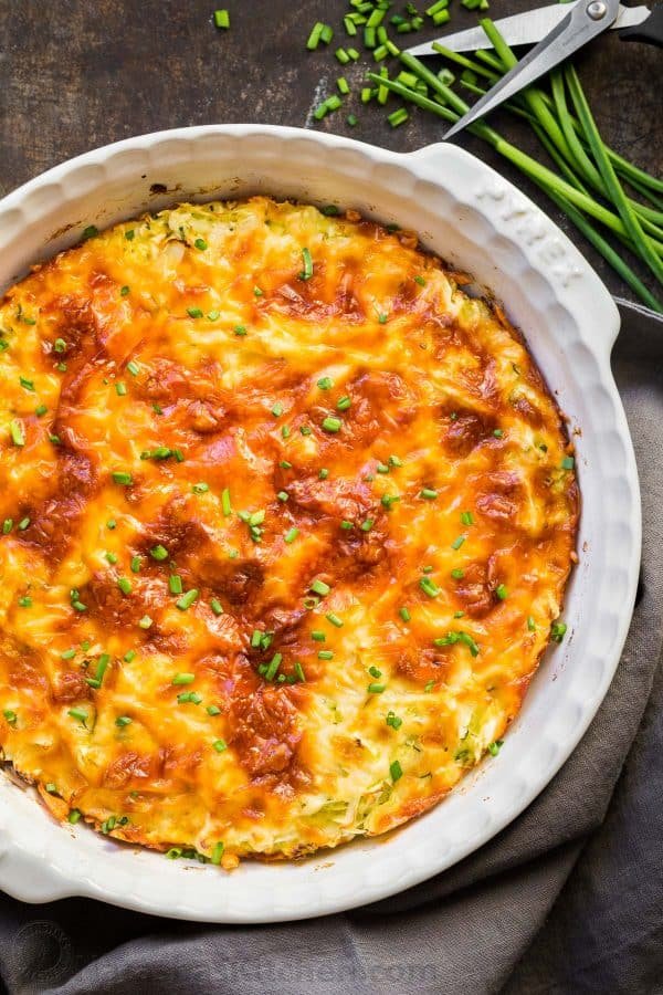 Savory cabbage pie loaded with cabbage and herbs. The batter makes it creamy and quiche-like. A golden cheesy crust takes this cabbage casserole over the top with a slight cheese pull when it's hot and fresh of the oven. | natashaskitchen.com