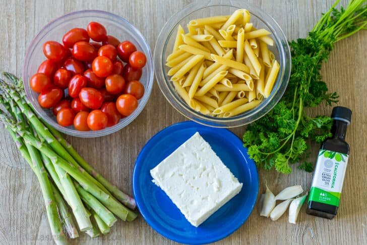 Ingredients for baked pasta with feta and tomatoes