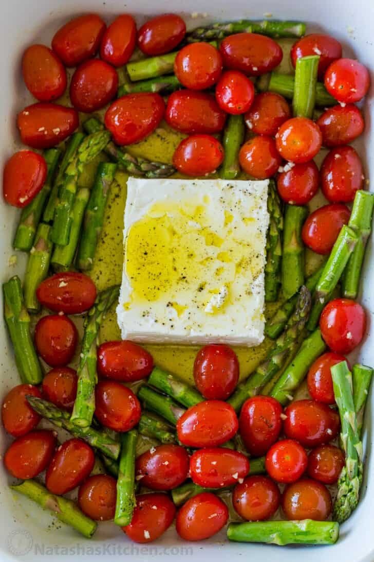 Baked feta and tomatoes in casserole dish