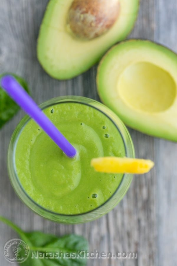 Healthy Avocado Smoothie in a cup with a straw
