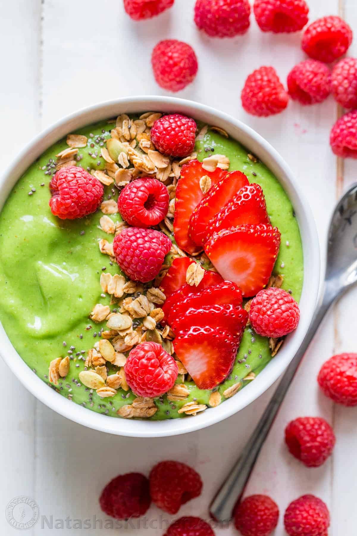Green smoothie bowl garnished with berries
