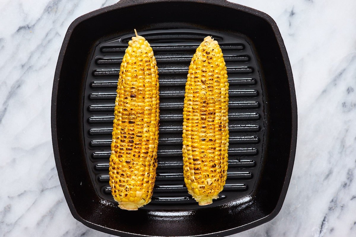 charred corn on grill pan. 