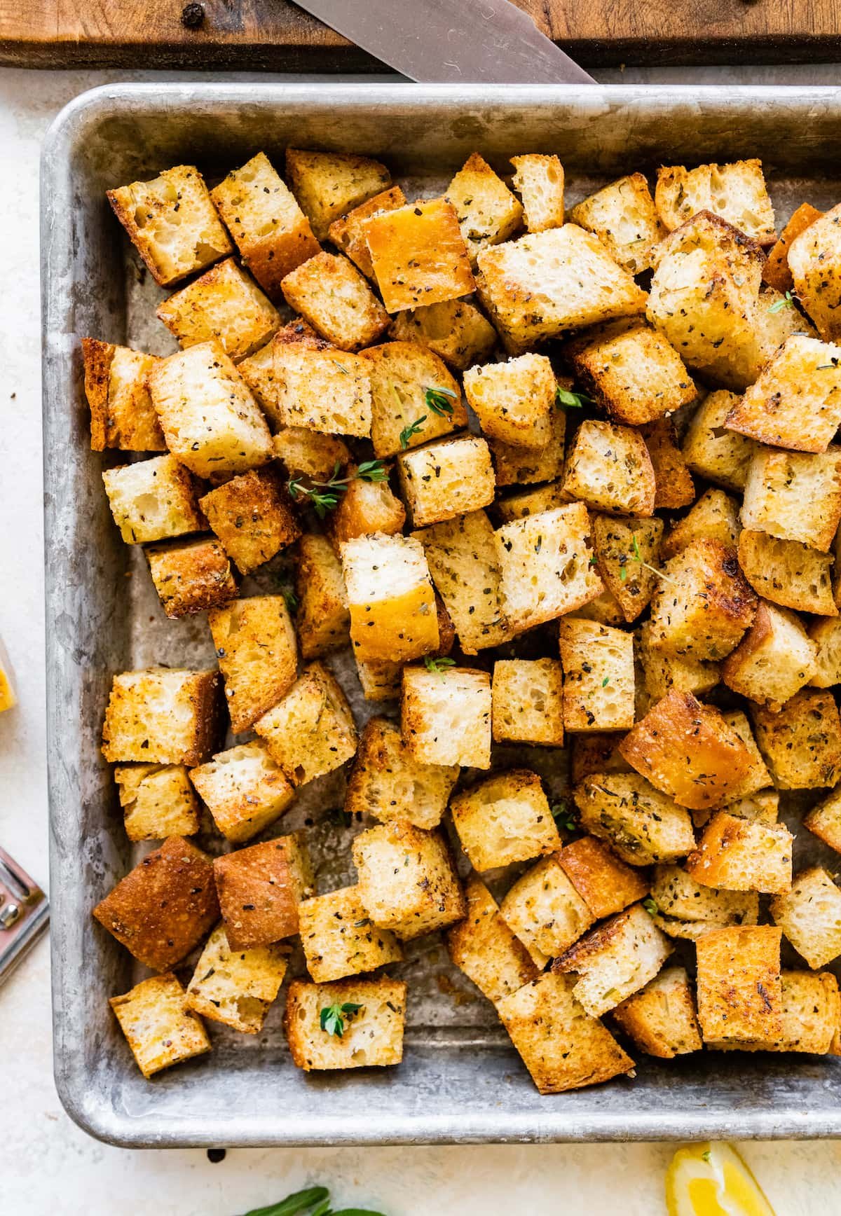 homemade croutons on baking sheet. 