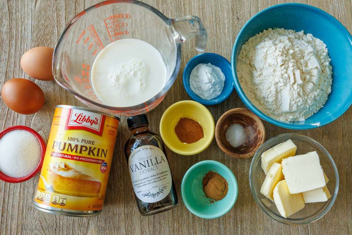 Ingredients to make delicious homemade pumpkin waffles- Libby's pumpkin puree, flour, eggs, butter, salt, vanilla, sugar, pumpkin spice, cinnamon, baking powder, milk