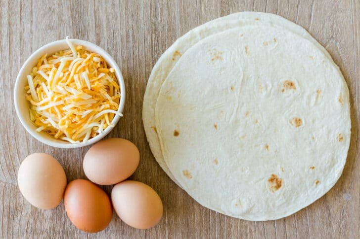 Ingredients for egg quesadillas with tortillas, eggs, cheese