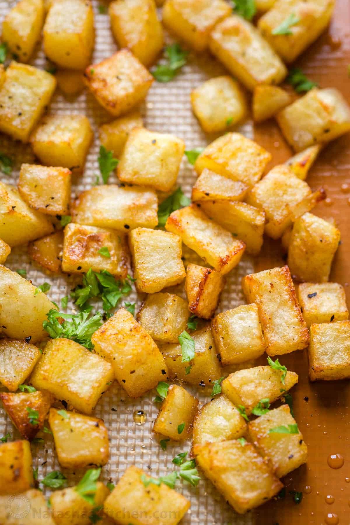 Our go-to, easy breakfast potatoes recipe uses simple ingredients and the best cooking method for potatoes, so each bite is delicious! crispy Breakfast potatoes cooked on a sheetpan