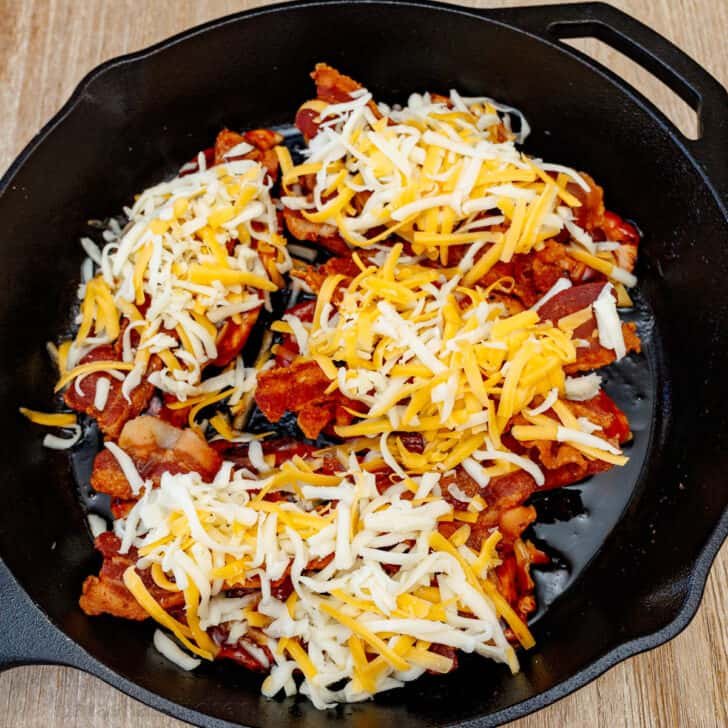 Our Chili's copycat Monterey Chicken recipe brings the grilled chicken, tangy BBQ, smoky bacon, and gooey cheese restaurant favorite home to your kitchen. 4 chicken breasts covered in bbq sauce, bacon, and shredded Monterey jack and cheddar cheeses in a skillet