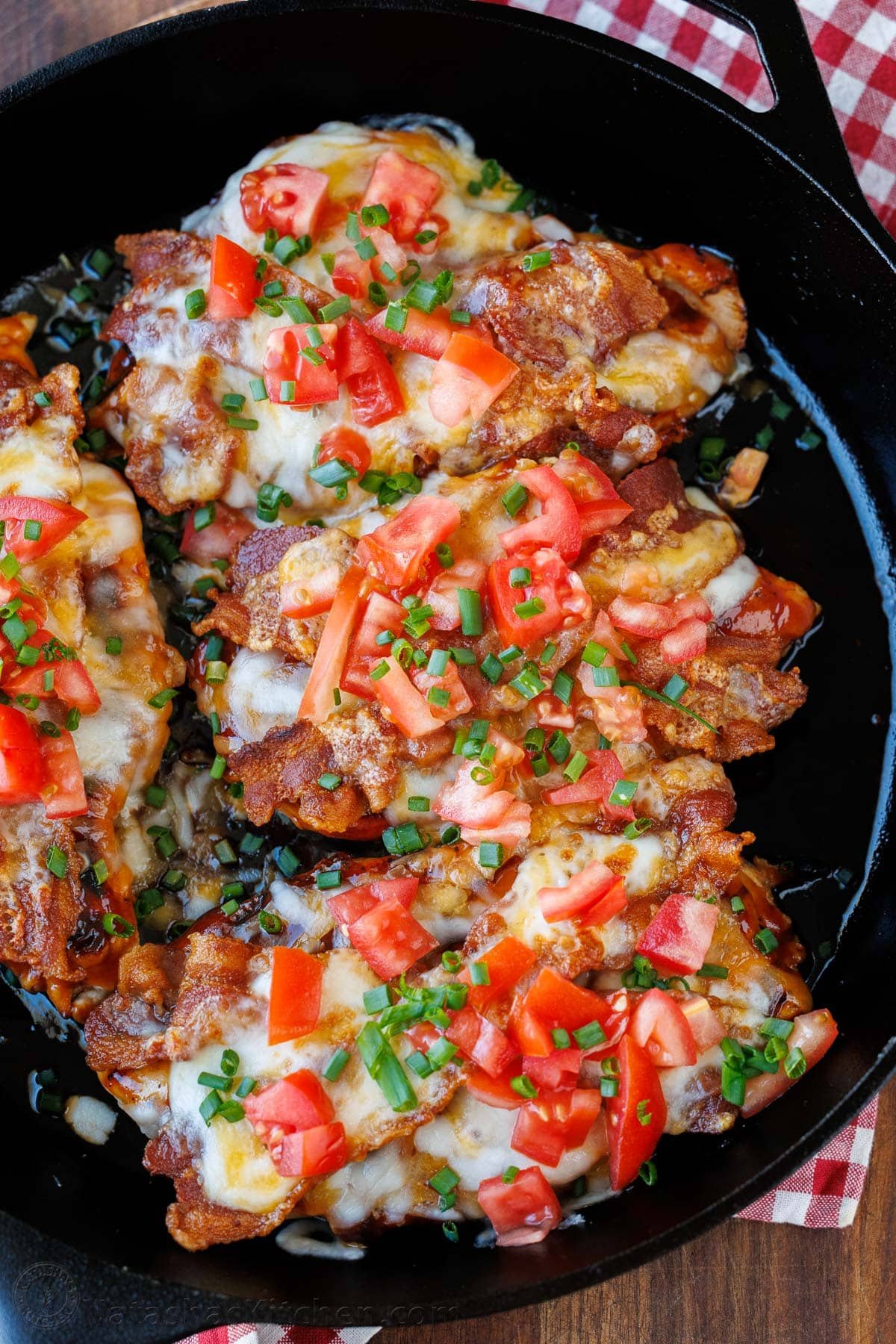 Our Chili's copycat Monterey Chicken recipe brings the grilled chicken, tangy BBQ, smoky bacon, and gooey cheese restaurant favorite home to your kitchen. Chili's copycat Monterey Chicken, loaded with bbq sauce, melted cheese, diced tomatoes, and green onions in a skillet