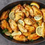 Lemon Pepper wings served with lemon wedges