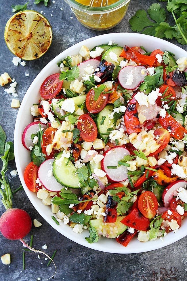 Summer Vegetable Salad With Charred Lime Vinaigrette Is The Perfect Side Dish For All Of Your Summer Meals! #salad #summer #vegetables #glutenfree #vegetarian #healthyrecipe #healthy Summer Vegetable Salad in bowl