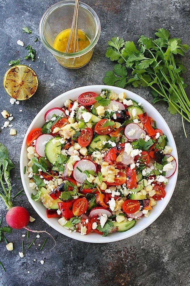 Summer Vegetable Salad With Charred Lime Vinaigrette Is The Perfect Side Dish For All Of Your Summer Meals! #salad #summer #vegetables #glutenfree #vegetarian #healthyrecipe #healthy #easyrecipe Grilled Summer Salad in bowl with charred lime vinaigrette