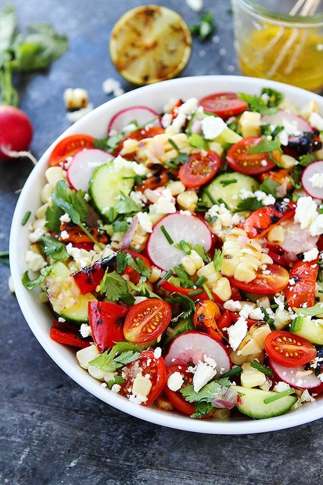 Summer Vegetable Salad With Charred Lime Vinaigrette Is The Perfect Side Dish For All Of Your Summer Meals! #salad #summer #vegetables #glutenfree #vegetarian #healthyrecipe #healthy #grilling #grilled Easy Grilled Summer Vegetable Salad in bowl with lime vinaigrette