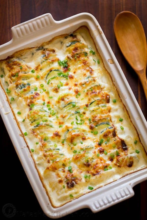 Creamy, cheesy Zucchini Potato Bake in a garlic Alfredo sauce. This potato bake recipe has simple ingredients, comes together quickly and tastes so good! | natashaskitchen.com
