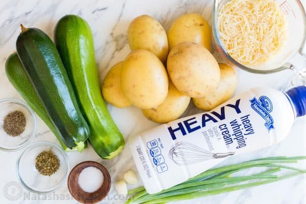 Creamy, cheesy Zucchini Potato Bake in a garlic Alfredo sauce. This potato bake recipe has simple ingredients, comes together quickly and tastes so good! | natashaskitchen.com