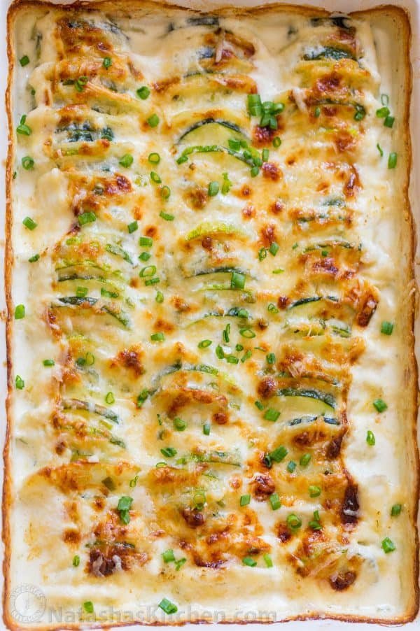 Creamy, cheesy Zucchini Potato Bake in a garlic Alfredo sauce. This potato bake recipe has simple ingredients, comes together quickly and tastes so good! | natashaskitchen.com