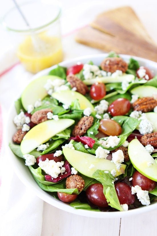 Apple, Grape, and Candied Pecan Salad with Maple-Mustard Dressing Recipe on twopeasandtheirpod.com The perfect salad for all of your holiday meals! Apple, Grape, and Candied Pecan Salad with Maple-Mustard Dressing Recipe